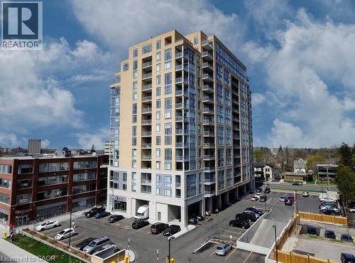 View of apartment building / complex with uncovered parking - 191 King Street S Unit# 712, Waterloo, ON - Outdoor With Balcony With Facade