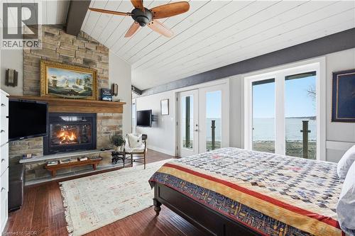 648 Front Road, St. Williams, ON - Indoor Photo Showing Bedroom With Fireplace