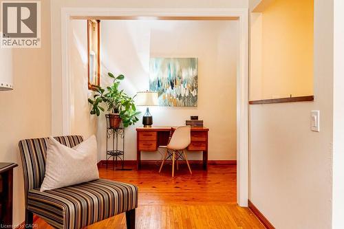 Home office with light wood-style floors and water heater - 218 Bay Street S, Hamilton, ON 