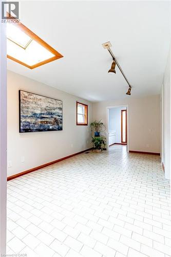 Spare room with track lighting and a skylight - 218 Bay Street S, Hamilton, ON 