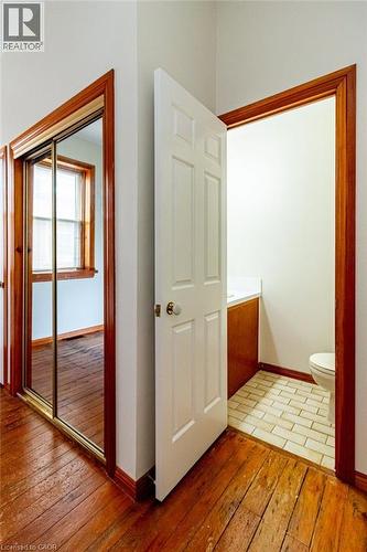 Bathroom with vanity and light wood-style flooring - 218 Bay Street S, Hamilton, ON 