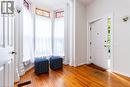 Entrance foyer with light wood-type flooring and healthy amount of natural light - 218 Bay Street S, Hamilton, ON 