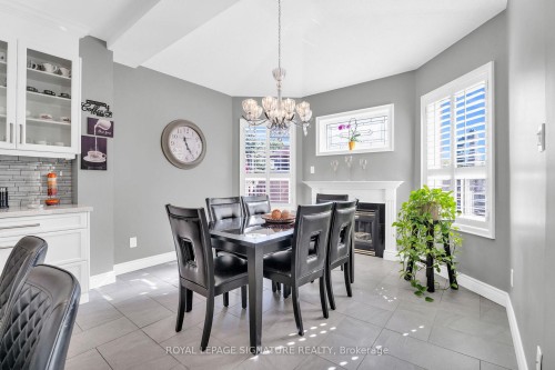 21 Bushberry Road, Brampton, ON - Indoor Photo Showing Dining Room With Fireplace