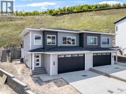 Backs onto Middleton Mountain Hiking Trails! - 442 Arrowleaf Rise, Coldstream, BC - Outdoor With Facade