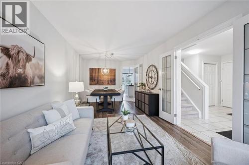 Living room with stairs and wood finished floors - 68 Newman Drive, Cambridge, ON - Indoor Photo Showing Living Room