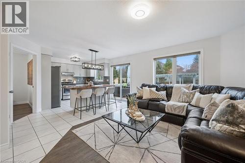 Living area with light tile patterned flooring - 68 Newman Drive, Cambridge, ON - Indoor Photo Showing Living Room
