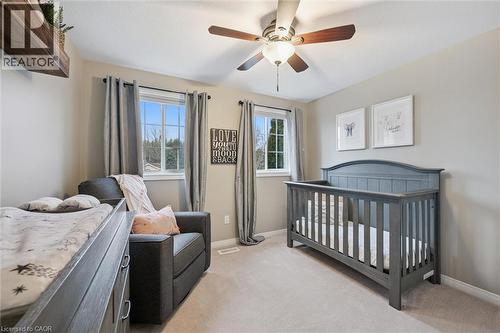 Bedroom with a nursery area, light colored carpet, and ceiling fan - 68 Newman Drive, Cambridge, ON - Indoor Photo Showing Bedroom