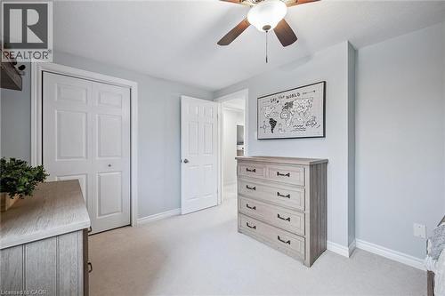 Bedroom featuring light carpet, ceiling fan, and a closet - 68 Newman Drive, Cambridge, ON - Indoor
