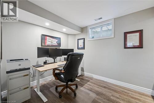 Office with dark wood-style flooring and recessed lighting - 68 Newman Drive, Cambridge, ON - Indoor Photo Showing Office