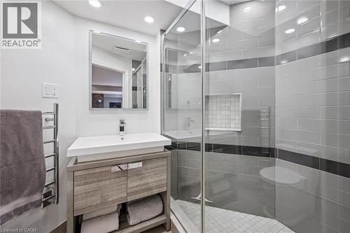 Full bathroom featuring vanity, a shower stall, recessed lighting, and a towel warmer - 68 Newman Drive, Cambridge, ON - Indoor Photo Showing Bathroom