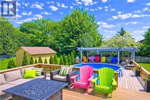 Wooden terrace featuring an outdoor lounge area, an outdoor structure, an outdoor pool, a patio area, and a pergola - 68 Newman Drive, Cambridge, ON - Outdoor With Deck Patio Veranda