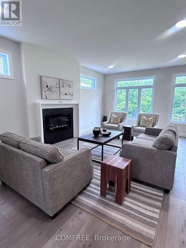 25-35 Old Course Road, St. Thomas, ON - Indoor Photo Showing Living Room With Fireplace