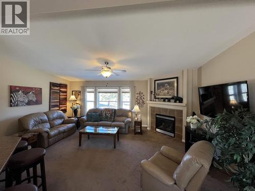 4 Reserve Road, Fort Nelson, BC - Indoor Photo Showing Living Room With Fireplace