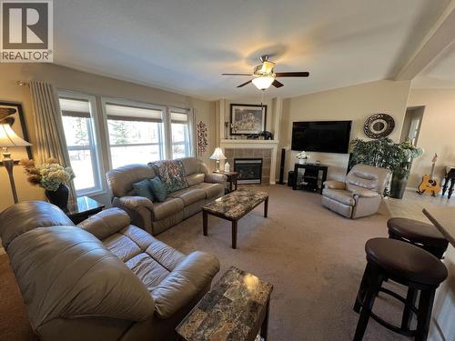 4 Reserve Road, Fort Nelson, BC - Indoor Photo Showing Living Room With Fireplace