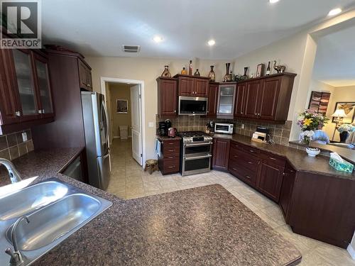 4 Reserve Road, Fort Nelson, BC - Indoor Photo Showing Kitchen With Double Sink