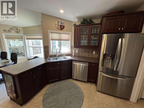 4 Reserve Road, Fort Nelson, BC - Indoor Photo Showing Kitchen With Double Sink