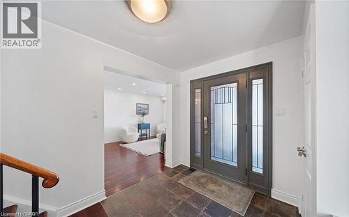 Entryway with baseboards and dark stone finish floors - 1550 Woodeden Drive, Mississauga, ON - Indoor Photo Showing Other Room