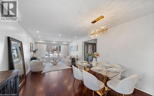 Dining space with dark wood-style floors and hanging lights - 1550 Woodeden Drive, Mississauga, ON - Indoor Photo Showing Dining Room