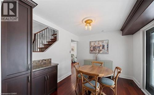 Dining space featuring baseboards and dark wood-style flooring - 1550 Woodeden Drive, Mississauga, ON - Indoor Photo Showing Dining Room