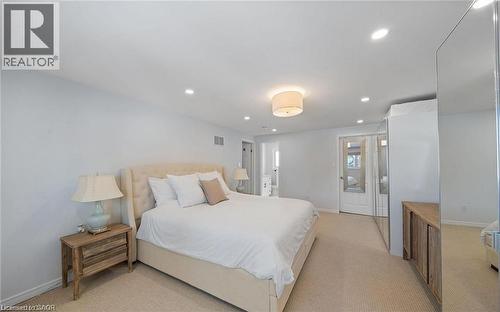 Bedroom featuring light colored carpet and recessed lighting - 1550 Woodeden Drive, Mississauga, ON - Indoor Photo Showing Bedroom