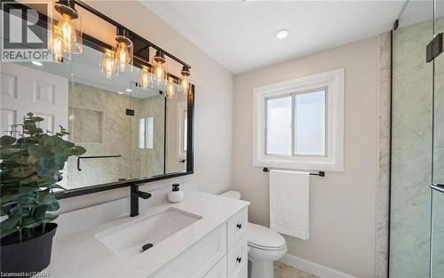 Bathroom featuring vanity and a marble finish shower - 1550 Woodeden Drive, Mississauga, ON - Indoor Photo Showing Bathroom