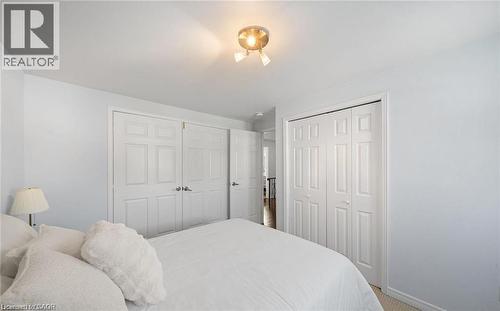 Bedroom with multiple closets and light carpet - 1550 Woodeden Drive, Mississauga, ON - Indoor Photo Showing Bedroom