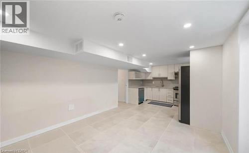 Kitchen featuring light countertops, white cabinets, recessed lighting, and stainless steel appliances - 1550 Woodeden Drive, Mississauga, ON - Indoor Photo Showing Kitchen