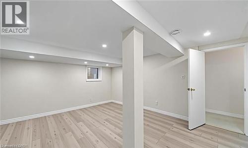 Finished basement with light wood-style floors and recessed lighting - 1550 Woodeden Drive, Mississauga, ON - Indoor