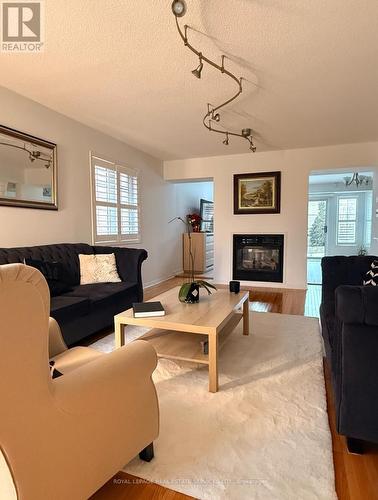 Upper - 5649 Condor Place, Mississauga, ON - Indoor Photo Showing Living Room With Fireplace