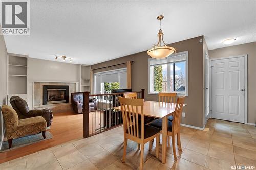 143 Biro Place, Saskatoon, SK - Indoor Photo Showing Dining Room With Fireplace