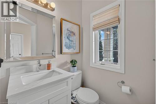 Half bathroom featuring toilet and vanity - 100 Garinger Crescent, Binbrook, ON - Indoor Photo Showing Bathroom