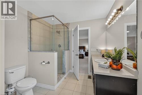 Ensuite bathroom featuring vanity, a shower stall, and light tile patterned flooring - 100 Garinger Crescent, Binbrook, ON - Indoor Photo Showing Bathroom