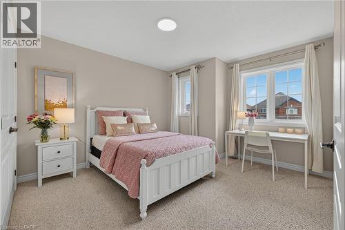 Bedroom with light carpet and baseboards - 100 Garinger Crescent, Binbrook, ON - Indoor Photo Showing Bedroom