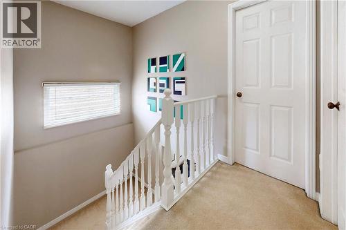 Hallway featuring light colored carpet and an upstairs landing - 62 Como Place, Hamilton, ON - Indoor Photo Showing Other Room