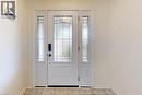 Doorway to outside with tile patterned floors and baseboards - 62 Como Place, Hamilton, ON  - Indoor Photo Showing Other Room 