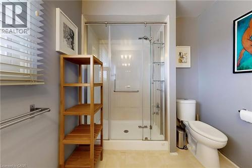 Bathroom featuring toilet and a shower stall - 62 Como Place, Hamilton, ON - Indoor Photo Showing Bathroom