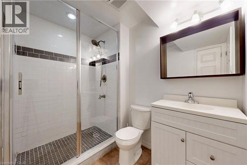 Bathroom with vanity, a shower stall, and light tile patterned floors - 62 Como Place, Hamilton, ON - Indoor Photo Showing Bathroom