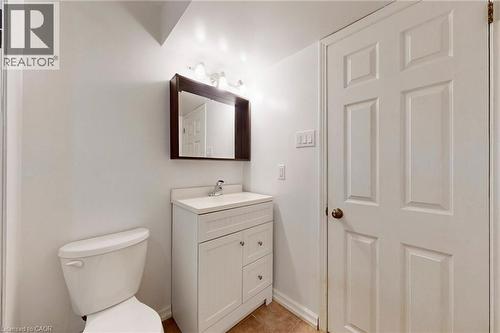Bathroom with vanity and light tile patterned floors - 62 Como Place, Hamilton, ON - Indoor Photo Showing Bathroom