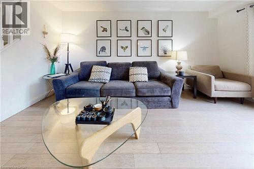Living area with light wood-style floors and baseboards - 62 Como Place, Hamilton, ON - Indoor Photo Showing Living Room