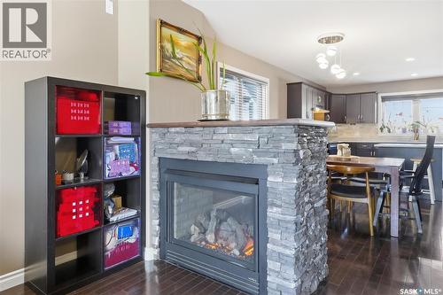 330 Lynd Lane, Saskatoon, SK - Indoor Photo Showing Dining Room With Fireplace