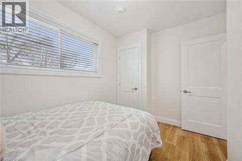 Bedroom with light wood-style floors and baseboards - 699 Frederick Street, Kitchener, ON - Indoor Photo Showing Bedroom