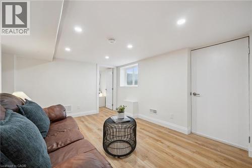 Living area with light wood finished floors and recessed lighting - 699 Frederick Street, Kitchener, ON - Indoor