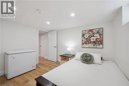 Bedroom with light wood finished floors and recessed lighting - 699 Frederick Street, Kitchener, ON - Indoor Photo Showing Bedroom