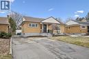 Bungalow-style home featuring brick siding, a shingled roof, and a chimney - 699 Frederick Street, Kitchener, ON  - Outdoor With Facade 