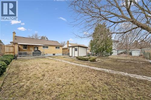 Rear view of property with a chimney and brick siding - 699 Frederick Street, Kitchener, ON - Outdoor With Deck Patio Veranda