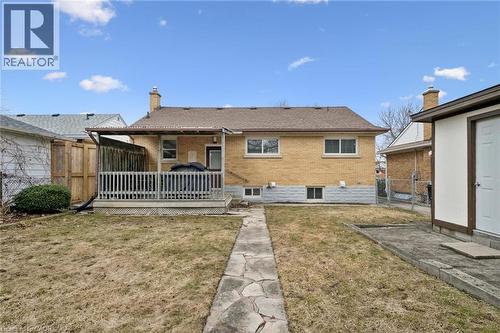 Rear view of property featuring a wooden deck, brick siding, a fenced backyard, a chimney, and a patio - 699 Frederick Street, Kitchener, ON - Outdoor With Deck Patio Veranda With Exterior