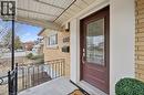 View of exterior entry with covered porch and brick siding - 699 Frederick Street, Kitchener, ON  - Outdoor With Exterior 