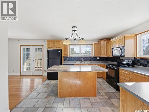 82 Burton Street, Grand Coulee, SK - Indoor Photo Showing Kitchen With Double Sink