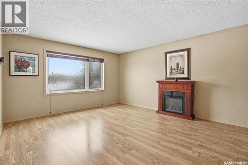 6914 Cunningham Drive, Regina, SK - Indoor Photo Showing Living Room With Fireplace