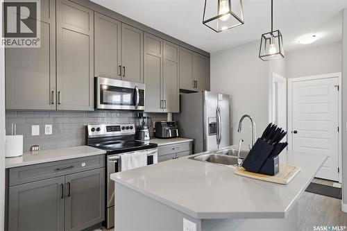 608 Brighton Gate, Saskatoon, SK - Indoor Photo Showing Kitchen With Stainless Steel Kitchen With Double Sink With Upgraded Kitchen